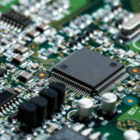 closeup-electronic-circuit-board-with-cpu-microchip-electronic-components-background